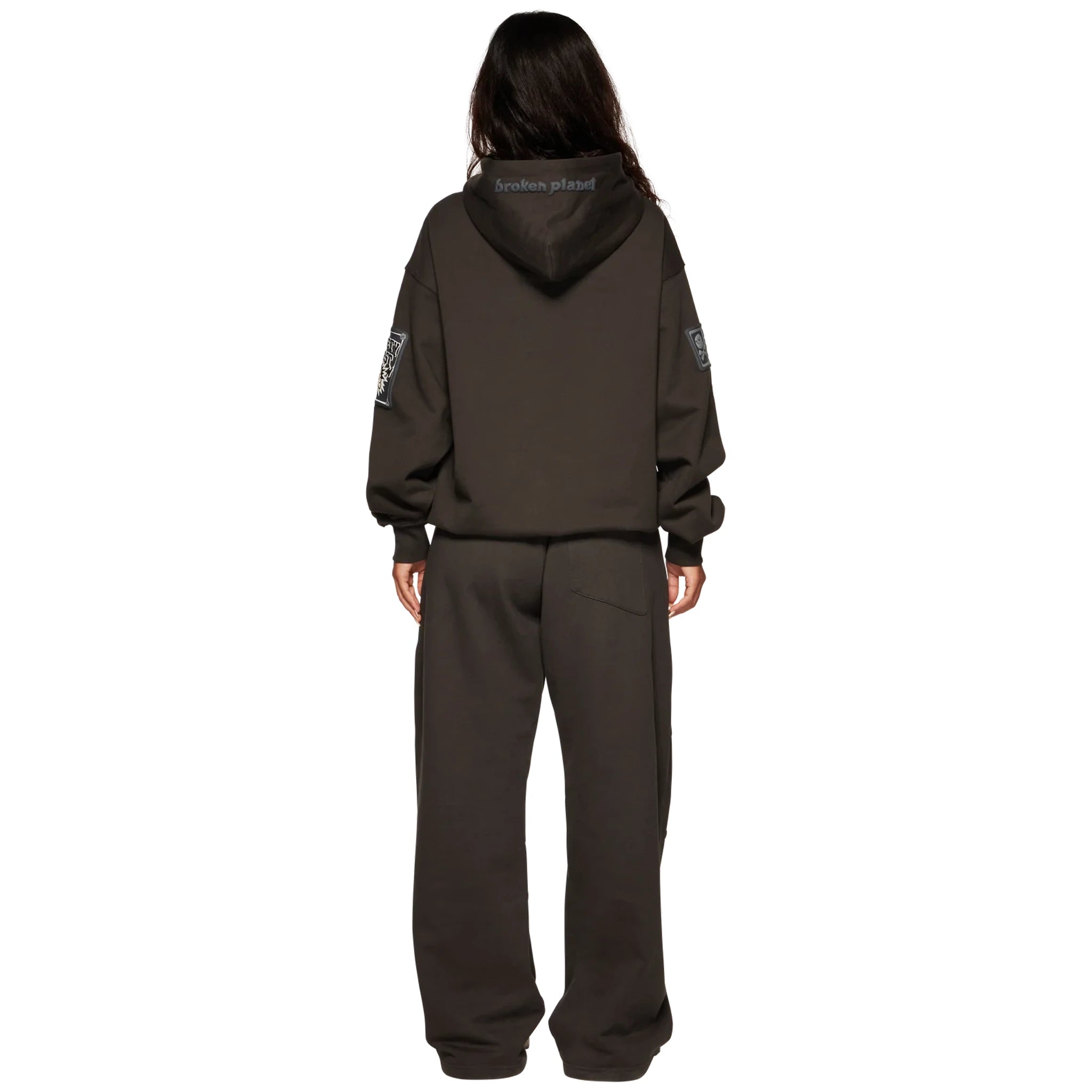 Model back view of Broken Planet Repair Services Soot Black Hoodie